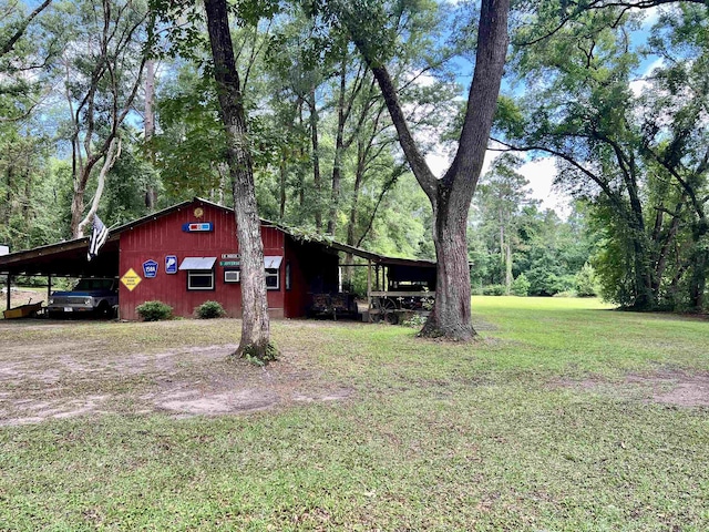 376 Tecumseh Rd, Monticello, FL 32344 - view of front of house with a carport and a front lawn