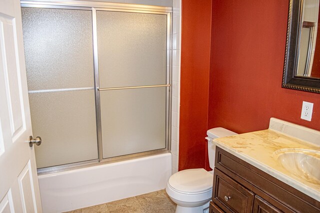 21 Blenheim Rd Fl, Shalimar, FL 32579 - full bathroom with shower / bath combination with glass door, vanity, and toilet