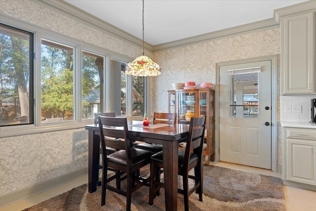 dining room with crown molding