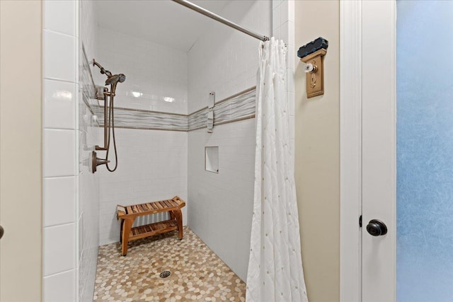 bathroom with a shower with shower curtain