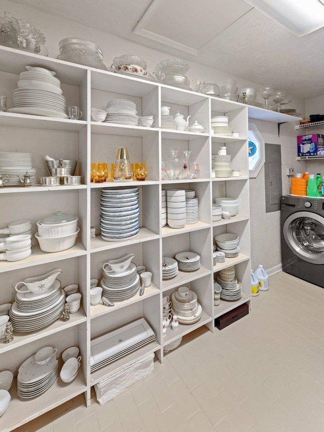 interior space featuring electric panel and washer / dryer