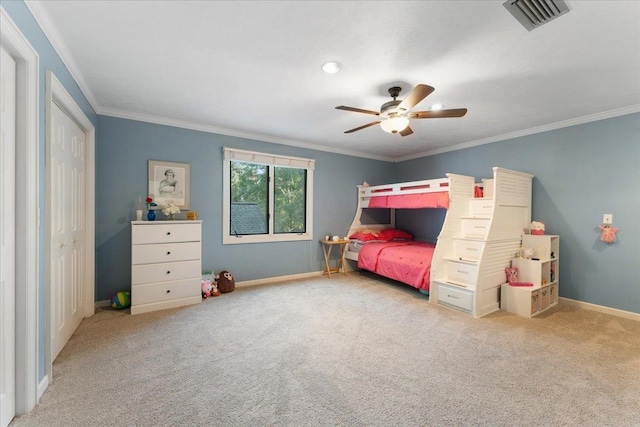 carpeted bedroom with ceiling fan and ornamental molding