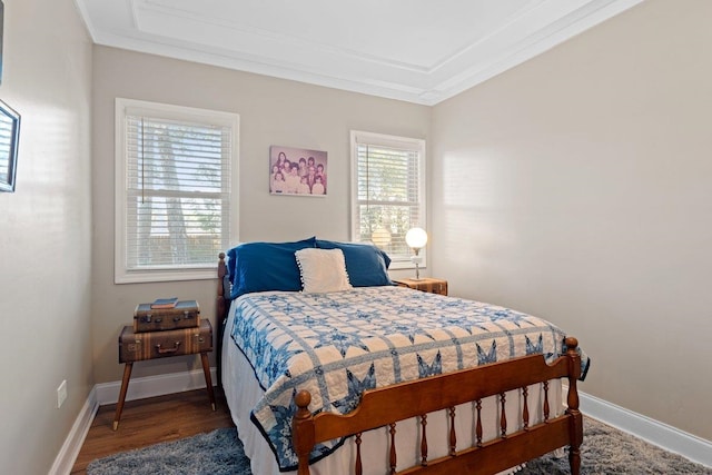 bedroom with wood-type flooring and ornamental molding