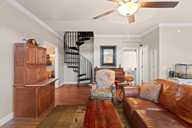 living room featuring hardwood / wood-style flooring, ceiling fan, and ornamental molding