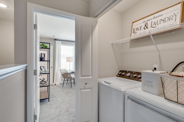 washroom featuring light carpet and washing machine and clothes dryer