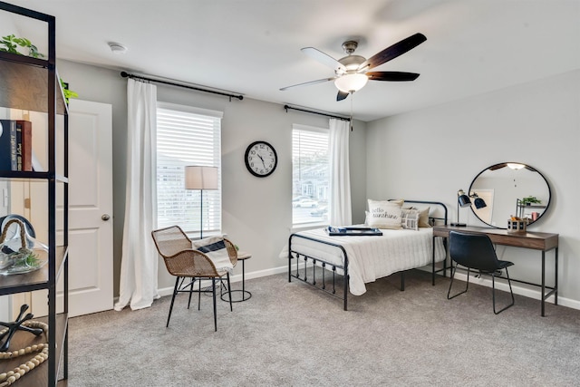 bedroom featuring light colored carpet and ceiling fan