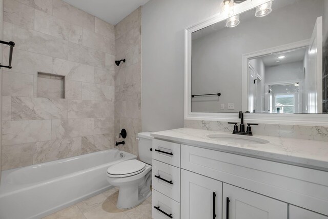 full bath with shower / bathtub combination, vanity, and toilet