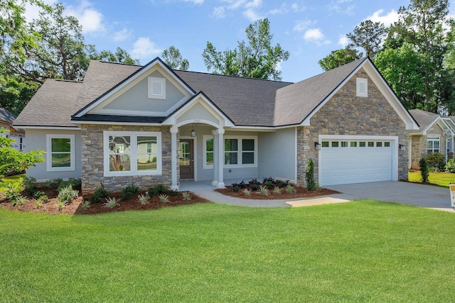 craftsman inspired home featuring a garage, a front yard, stone siding, roof with shingles, and concrete driveway