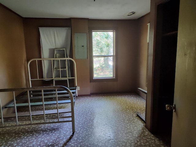 1618 Golf Course Rd, Perry, FL 32347 - bedroom featuring electric panel and baseboards