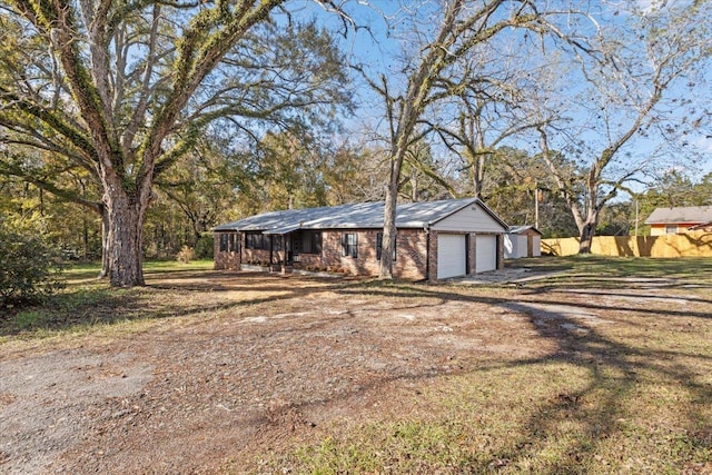 ranch-style home featuring a garage