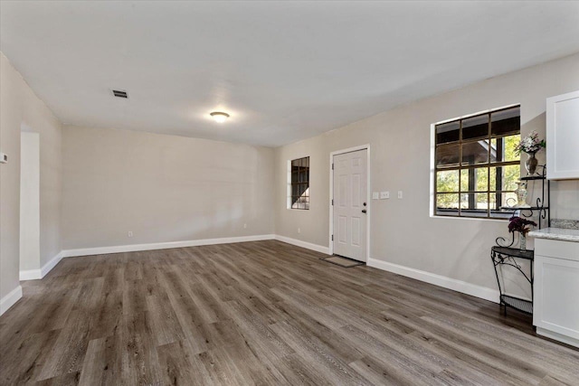 interior space with dark hardwood / wood-style floors