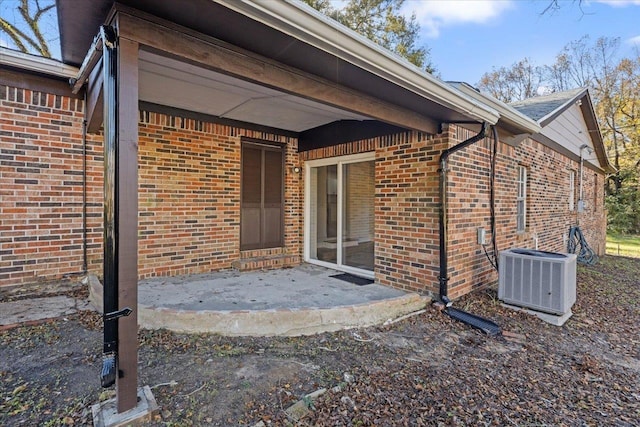 exterior space with central AC and a patio