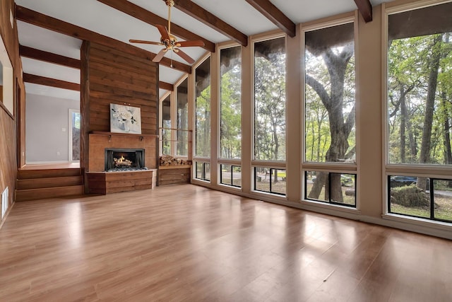 3508 Willow Springs Ln, Tallahassee, FL 32312 - unfurnished living room with healthy amount of natural light, a warm lit fireplace, and ceiling fan