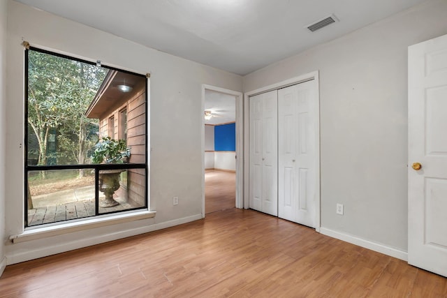 3508 Willow Springs Ln, Tallahassee, FL 32312 - unfurnished bedroom with wood finished floors and a closet