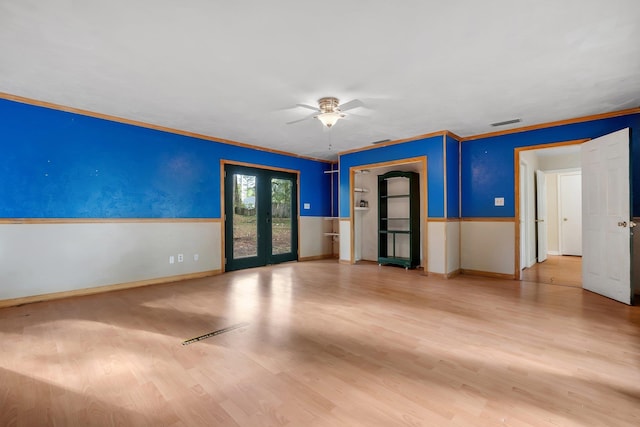 3508 Willow Springs Ln, Tallahassee, FL 32312 - spare room featuring french doors, wood finished floors, a ceiling fan, and ornamental molding