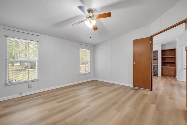 3375 Ben Stoutamire Rd, Tallahassee, FL 32310 - spare room with a ceiling fan, light wood-style flooring, baseboards, and lofted ceiling