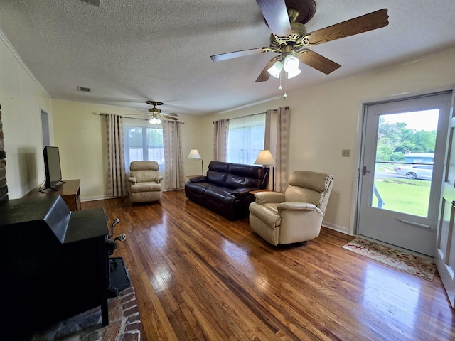 2612 W Tharpe St, Tallahassee, FL 32303 - living room with wood-type flooring, ceiling fan, a textured ceiling, and crown molding