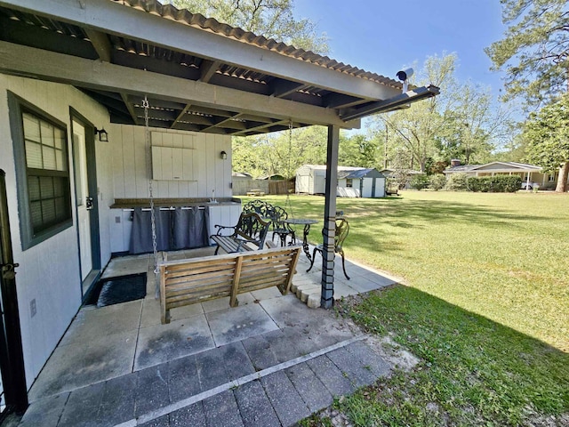 2612 W Tharpe St, Tallahassee, FL 32303 - view of patio featuring a shed
