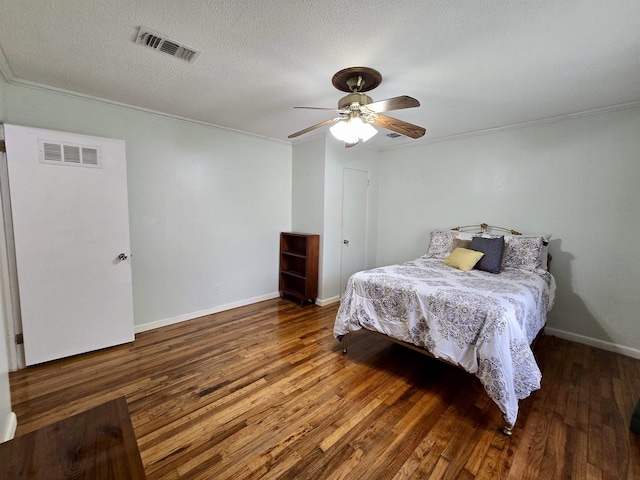 2612 W Tharpe St, Tallahassee, FL 32303 - bedroom featuring wood finished floors, crown molding, ceiling fan, and a textured ceiling