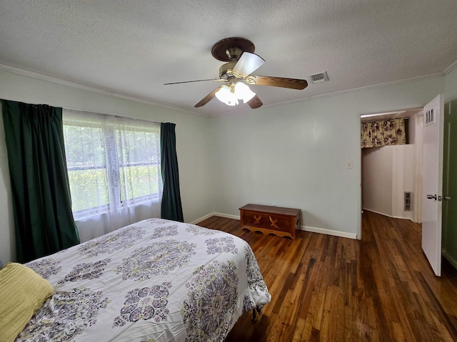 2612 W Tharpe St, Tallahassee, FL 32303 - bedroom with wood finished floors, crown molding, a textured ceiling, and a ceiling fan