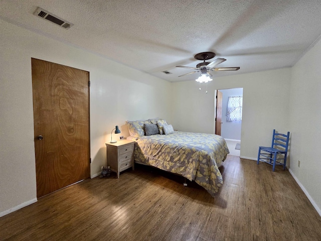 2612 W Tharpe St, Tallahassee, FL 32303 - bedroom with wood finished floors, a textured ceiling, and a ceiling fan