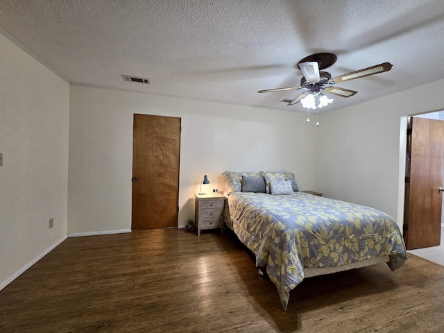 2612 W Tharpe St, Tallahassee, FL 32303 - bedroom with wood finished floors, a textured ceiling, and a ceiling fan