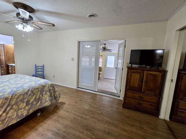 2612 W Tharpe St, Tallahassee, FL 32303 - bedroom featuring wood finished floors, a textured ceiling, and a ceiling fan
