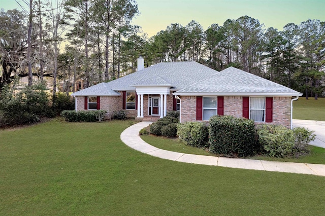 ranch-style house with a yard