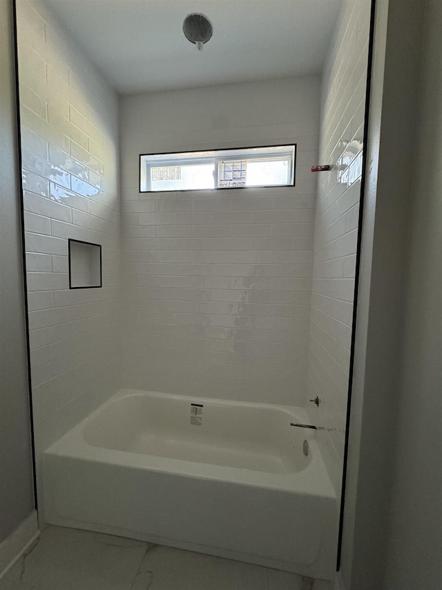 full bathroom with marble finish floor and shower / tub combination