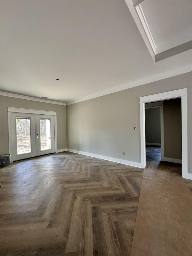 unfurnished room with crown molding, french doors, and baseboards