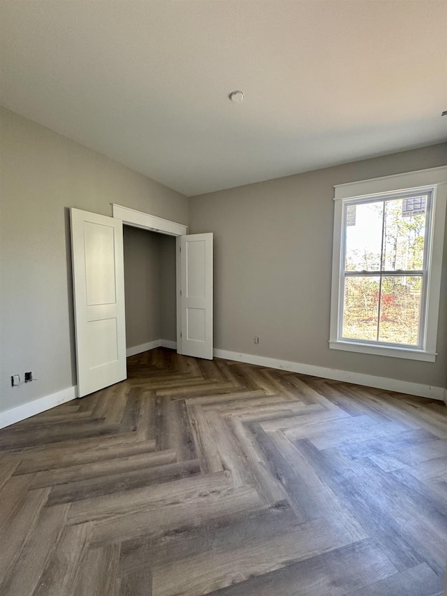 unfurnished bedroom featuring baseboards