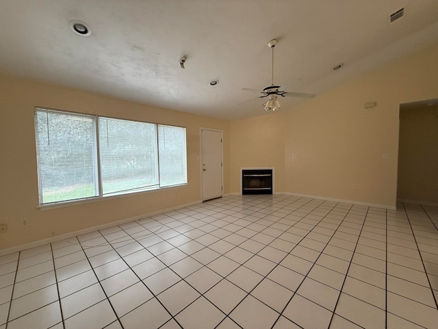 unfurnished living room with light tile patterned floors and ceiling fan