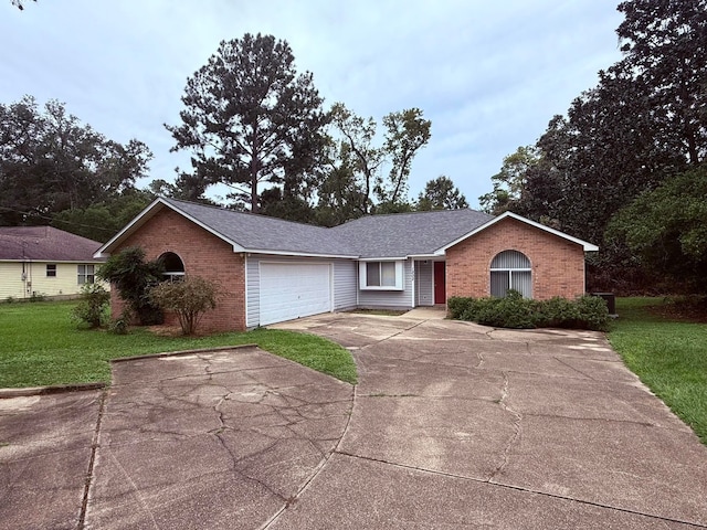 ranch-style house with a front yard and a garage