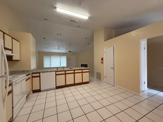 kitchen with kitchen peninsula, ceiling fan, light tile patterned floors, and white appliances