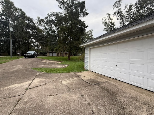 garage with a lawn