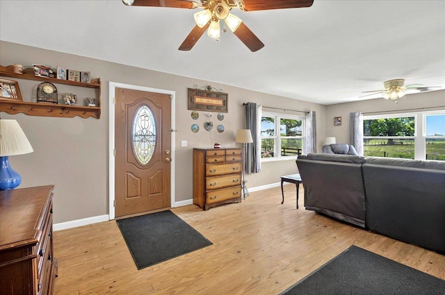 5975 Mount Pleasant Rd, Quincy, FL 32352 - entrance foyer with a ceiling fan, light wood-style flooring, and baseboards