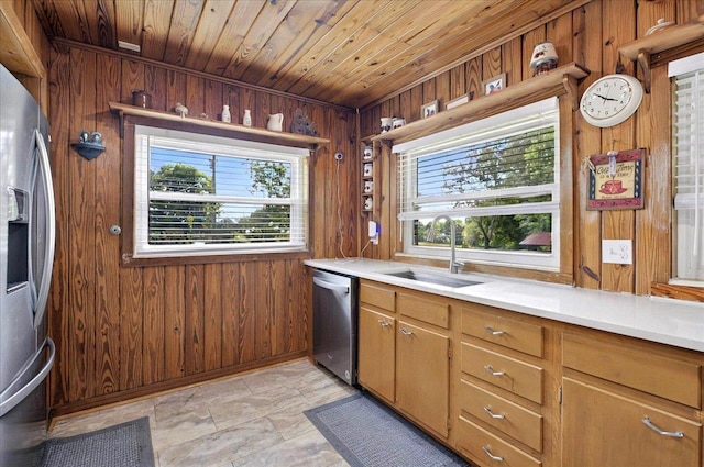5975 Mount Pleasant Rd, Quincy, FL 32352 - kitchen with a sink, wooden walls, stainless steel appliances, wood ceiling, and light countertops
