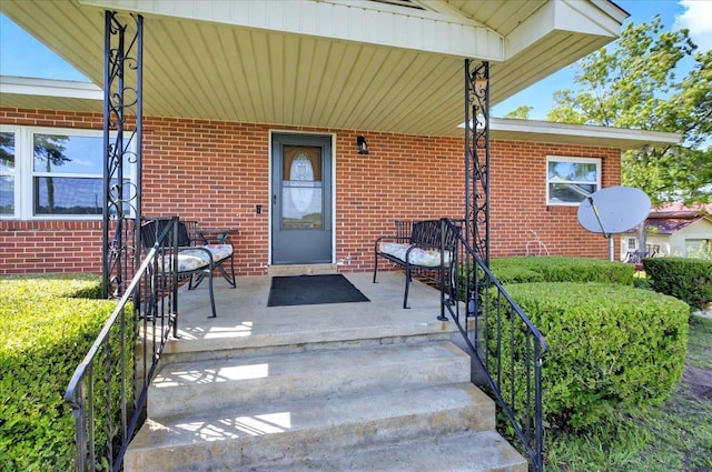5975 Mount Pleasant Rd, Quincy, FL 32352 - doorway to property featuring brick siding and covered porch