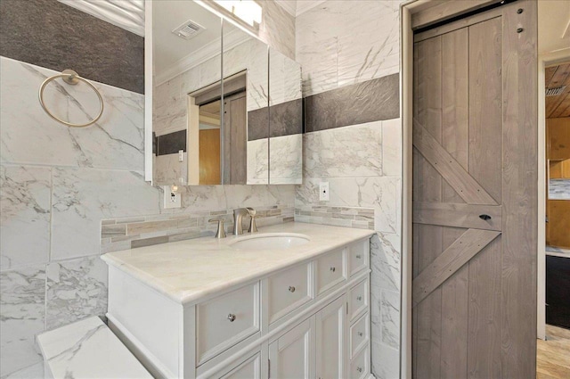 5975 Mount Pleasant Rd, Quincy, FL 32352 - bathroom featuring crown molding, tile walls, vanity, and marble finish floors