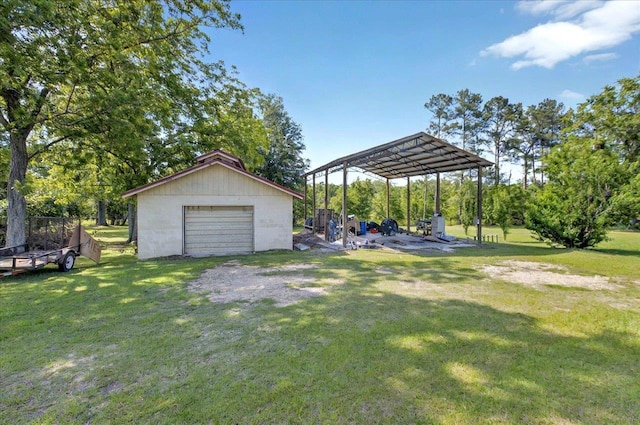 5975 Mount Pleasant Rd, Quincy, FL 32352 - view of grassy yard featuring an outdoor structure, a detached garage, and a detached carport