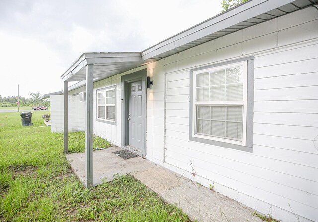 1315 S Center St Unit 1, Perry, FL 32348 - property entrance featuring a yard