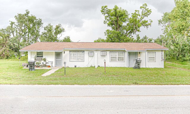 1315 S Center St Unit 1, Perry, FL 32348 - view of front facade with a front yard and a porch
