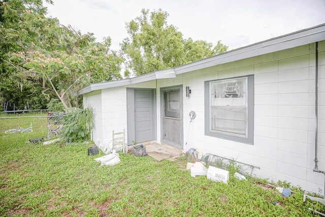 1315 S Center St Unit 1, Perry, FL 32348 - doorway to property featuring concrete block siding