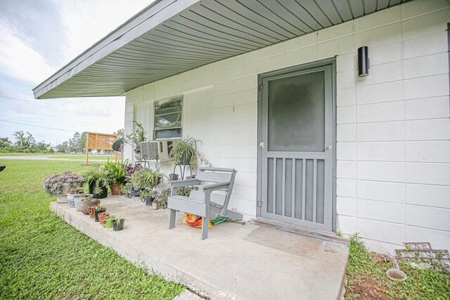 1315 S Center St Unit 1, Perry, FL 32348 - entrance to property with a lawn and cooling unit