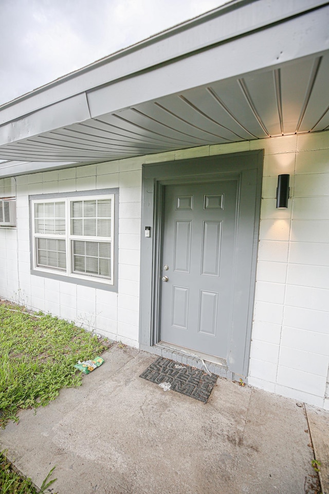 1315 S Center St Unit 1, Perry, FL 32348 - property entrance featuring concrete block siding and an AC wall unit