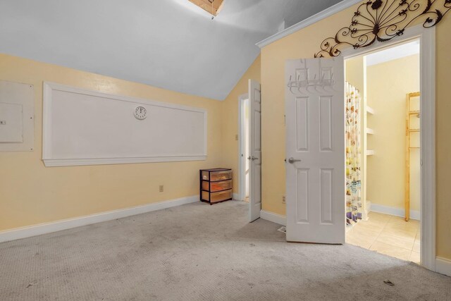924 S Lipona Rd, Tallahassee, FL 32304 - unfurnished bedroom with electric panel, carpet floors, and vaulted ceiling