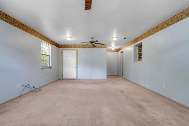 820 Essex Dr, Tallahassee, FL 32304 - spare room featuring a ceiling fan, light colored carpet, and baseboards