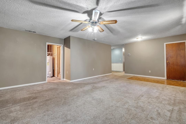 820 Essex Dr, Tallahassee, FL 32304 - unfurnished room featuring electric water heater, ceiling fan, a textured ceiling, baseboards, and carpet