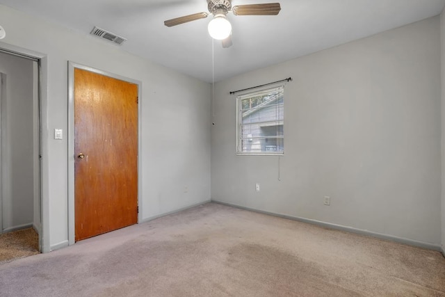 820 Essex Dr, Tallahassee, FL 32304 - unfurnished bedroom with carpet flooring, baseboards, and ceiling fan