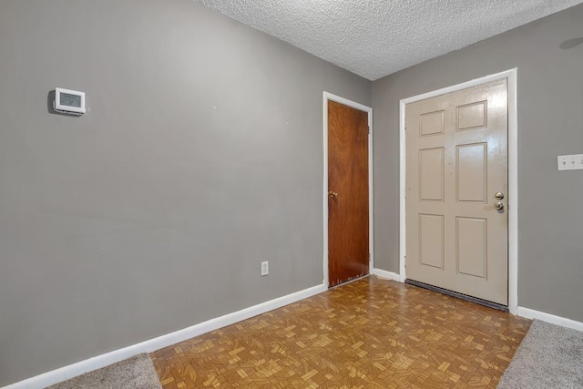 820 Essex Dr, Tallahassee, FL 32304 - entryway featuring baseboards and a textured ceiling